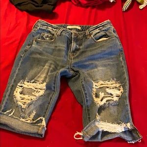 Ripped up mid length shorts